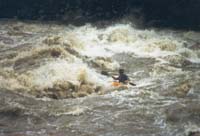 Getting stuck into some of the more friendly stuff on the Upano in high water...